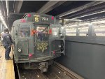 An MTA Employee talking to the motorman of the holiday train just before departure from 2nd Avenue Station 